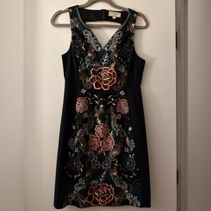 Gorgeous navy Anthropologie embroidered dress.  Cutout back with elastic detail.